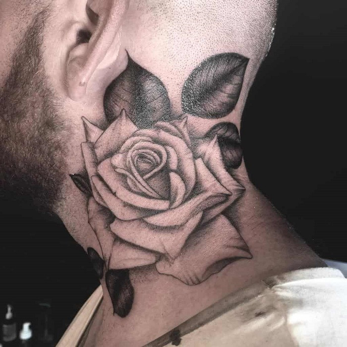 Fine line rose tattoo on the neck with incredibly thin and delicate lines, creating a subtle design.