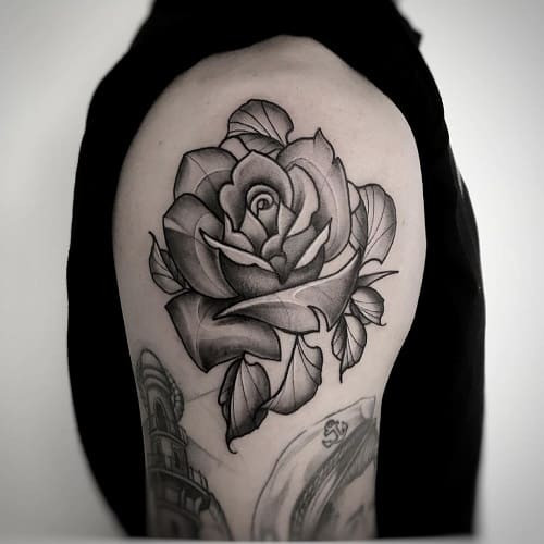 Complimentary rose shoulder tattoo