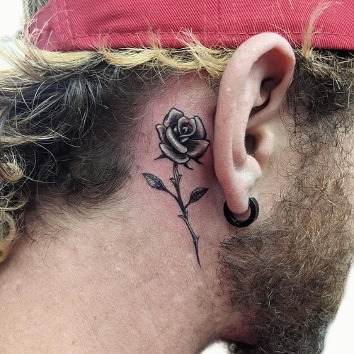Delicate rose tattoo behind ear