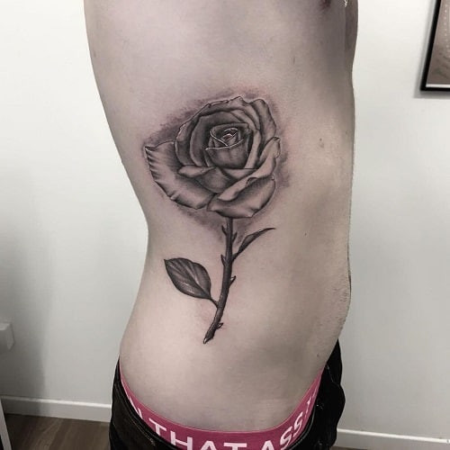 Detailed rose tattoo drawing in black and grey