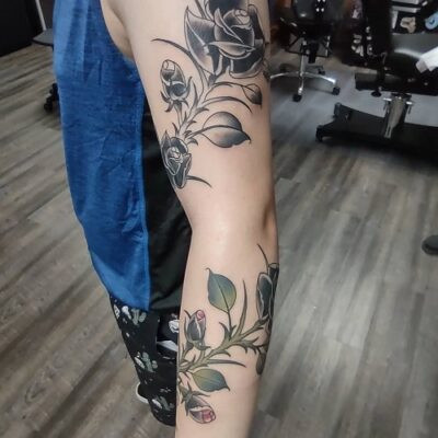 Elaborate rose vine tattoo design