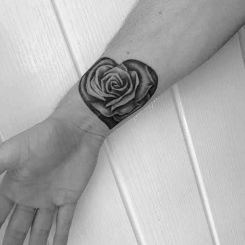 Intriguing rose wrist tattoo placement