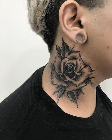 A man with a minimalist line art rose neck tattoo, demonstrating a modern take on the classic rose design with simple elegance.