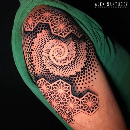 Sacred geometric tattoo showcasing intricate patterns and symbols with spiritual connotations.