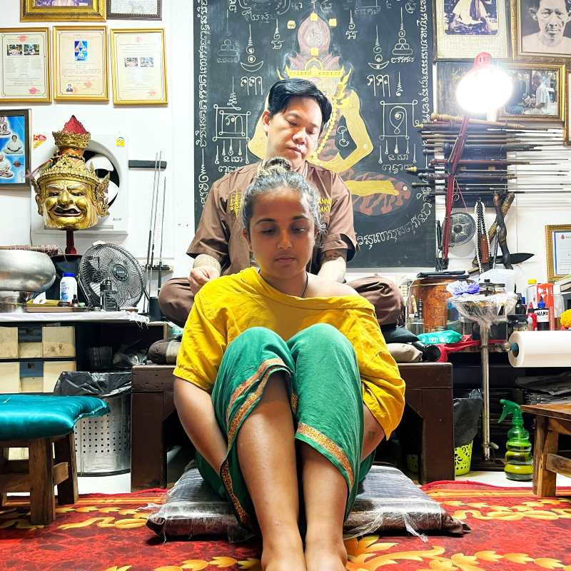 Inside Ajarn Neng's Samnak, a clean and hygienic studio offering authentic Sak Yant tattoo experiences in Thailand.