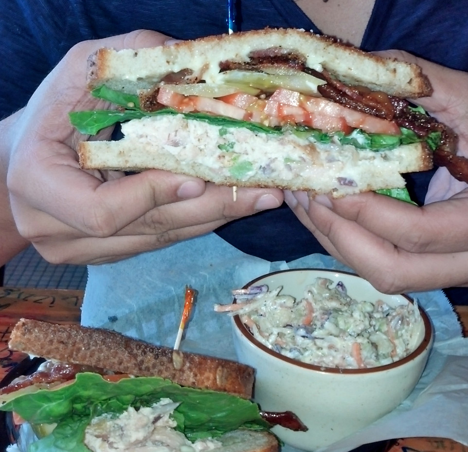 Image of a creamy bacon bleu cheese slaw, highlighting the texture and visible blue cheese crumbles