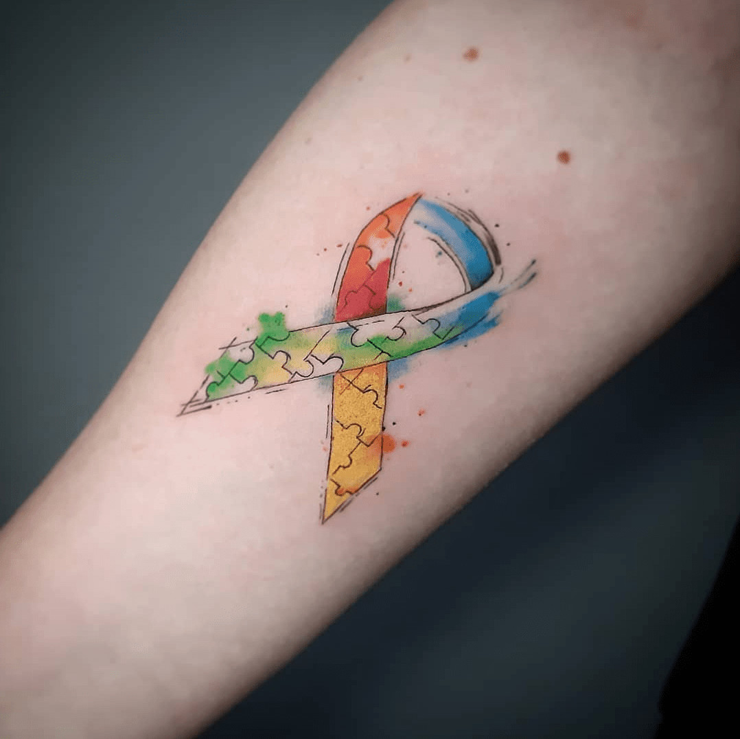 Interlocking puzzle piece hearts tattoo, representing love and connection within autism community