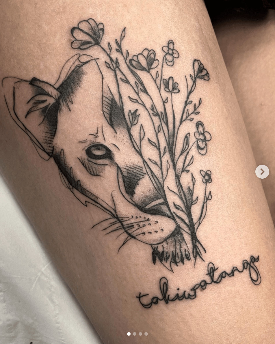 Takiwātanga word tattoo with subtle botanical design elements