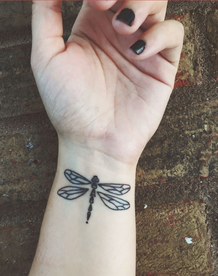 Butterfly wrist tattoo symbolizing transformation and personal growth