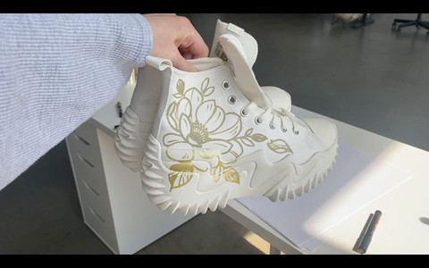 Anemone flower design on shoe, highlighting specific floral choice and detail