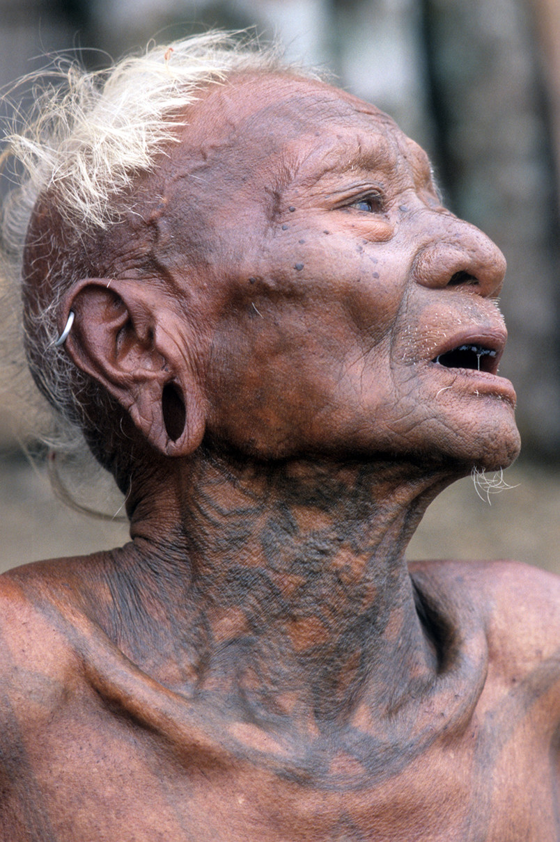 Konyak warrior Nokngam, faded tattoos marking warrior status