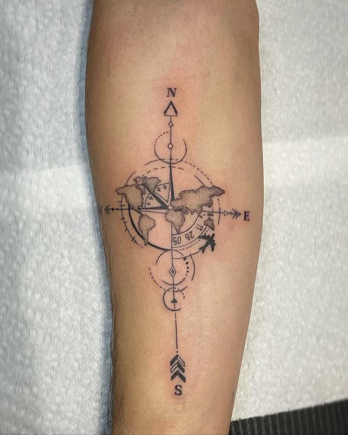 Simple compass tattoo on hand, small black ink minimalist design for men.