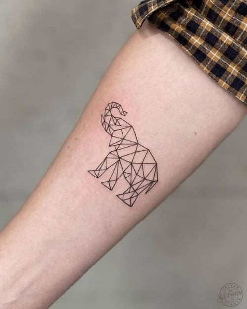 Simple elephant head tattoo on ankle, minimalist outline tattoo for men.