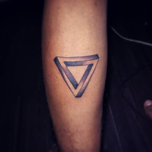 Simple geometric tattoo with a minimalist design, using basic geometric shapes for a subtle and elegant look.