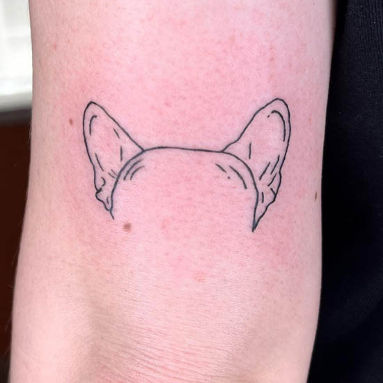 Simple line illustration dog ears tattoo