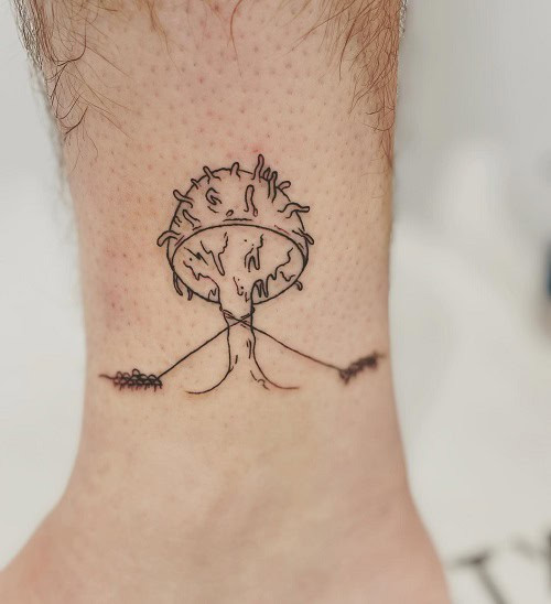 Simple mushroom tattoo on leg, minimalist black ink design for men.