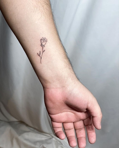 Minimalist simple rose outline tattoo