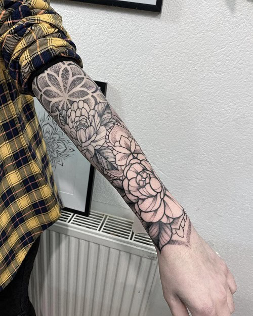 Simple minimalist sleeve tattoo, geometric and line work black ink for men.