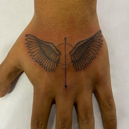 Simple wings outline tattoo on back of neck, minimalist black ink for men.