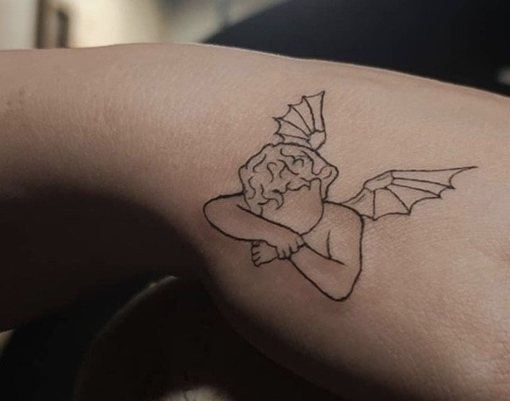 Ultra-minimalist tiny angel outline tattoo, offering a whisper of symbolism in a discreet design.