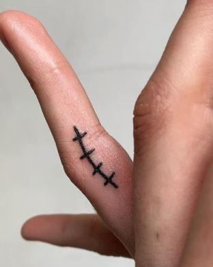 Simple line finger tattoo, a minimalist and elegant design for men