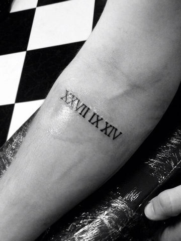 Roman Numerals Forearm Tattoo: Simple Date Tattoo for Men