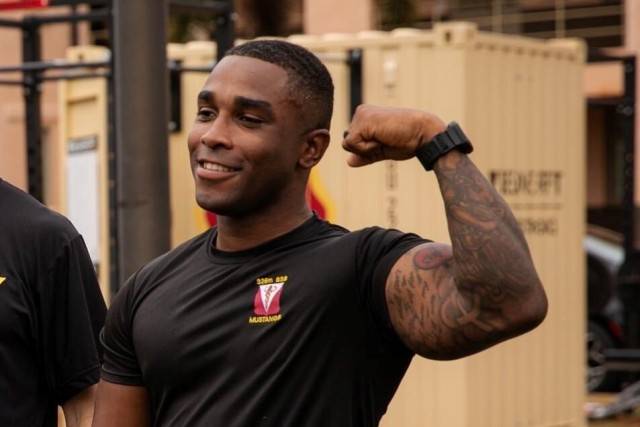 A Soldier from 325th Brigade Support Battalion demonstrating physical readiness after training, showcasing the evolving acceptance of tattoos in the U.S. Army under the updated policy.