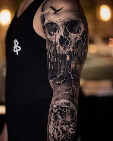 A skull half sleeve tattoo incorporating floral elements for contrast.