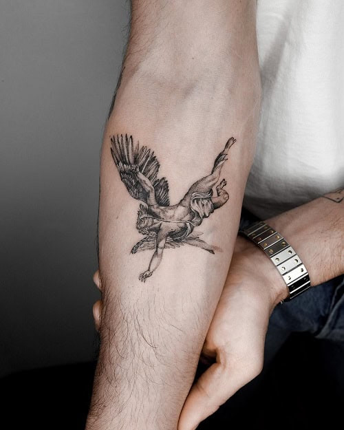 Small forearm tattoo with a minimalist design on a man's forearm