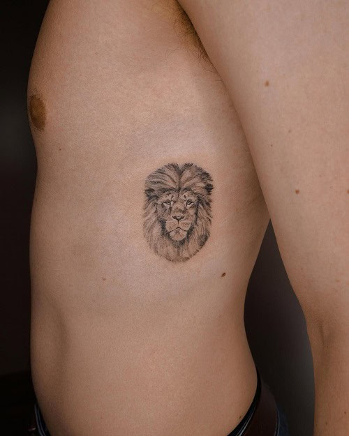 Minimalist Small Lion Tattoo on Chest