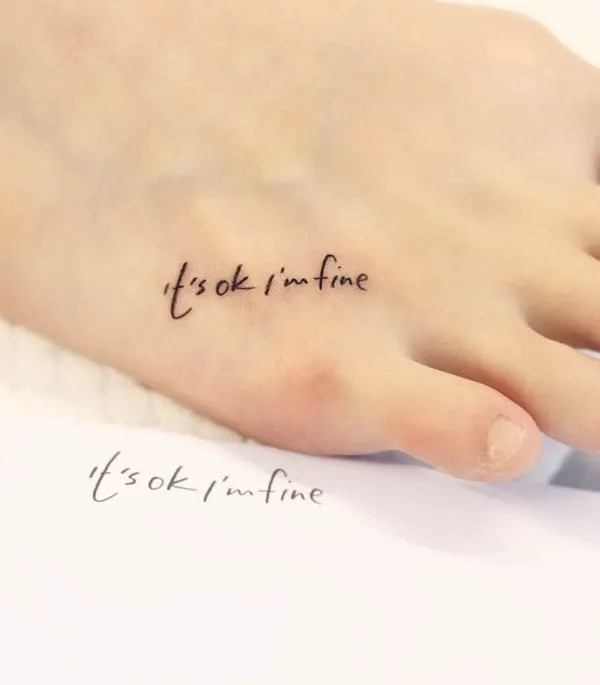 Small quote tattoo on the foot, a personal mantra or inspirational phrase for daily motivation