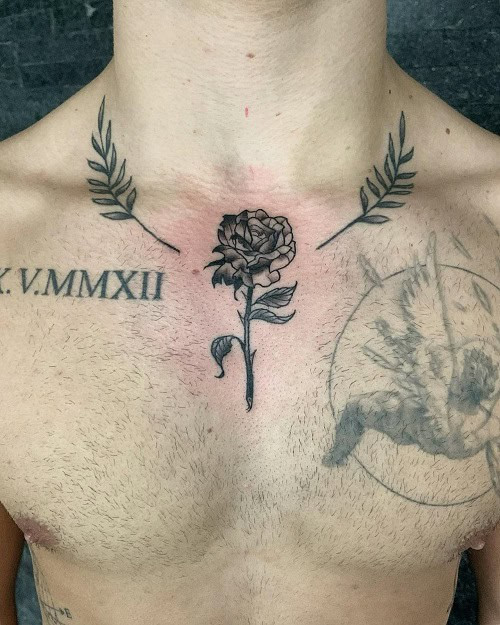 Small sternum tattoo with a geometric design on a man's sternum