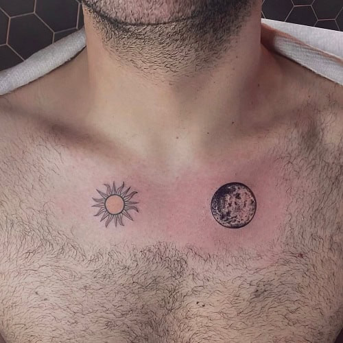 Small sun tattoo with geometric rays on a man's wrist