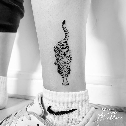 Minimalist small tiger tattoo with subtle impact