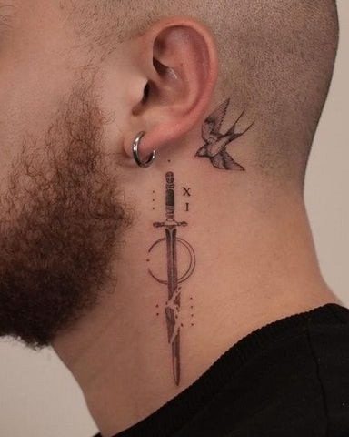 A man showcasing a small geometric symbol neck tattoo, highlighting a simple yet impactful minimalist approach.