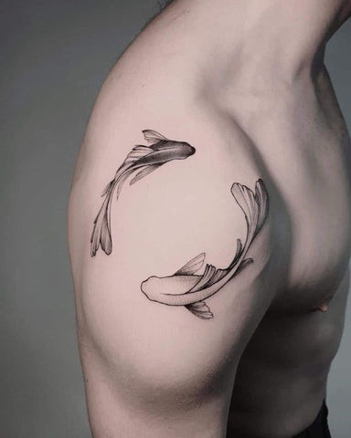 A minimalist geometric triangle tattoo on a man's collarbone area