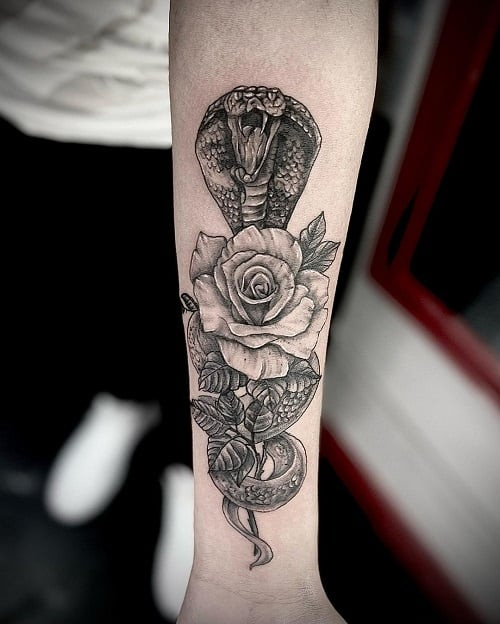 Snake and Rose Forearm Tattoo in Traditional Style with Bold Lines