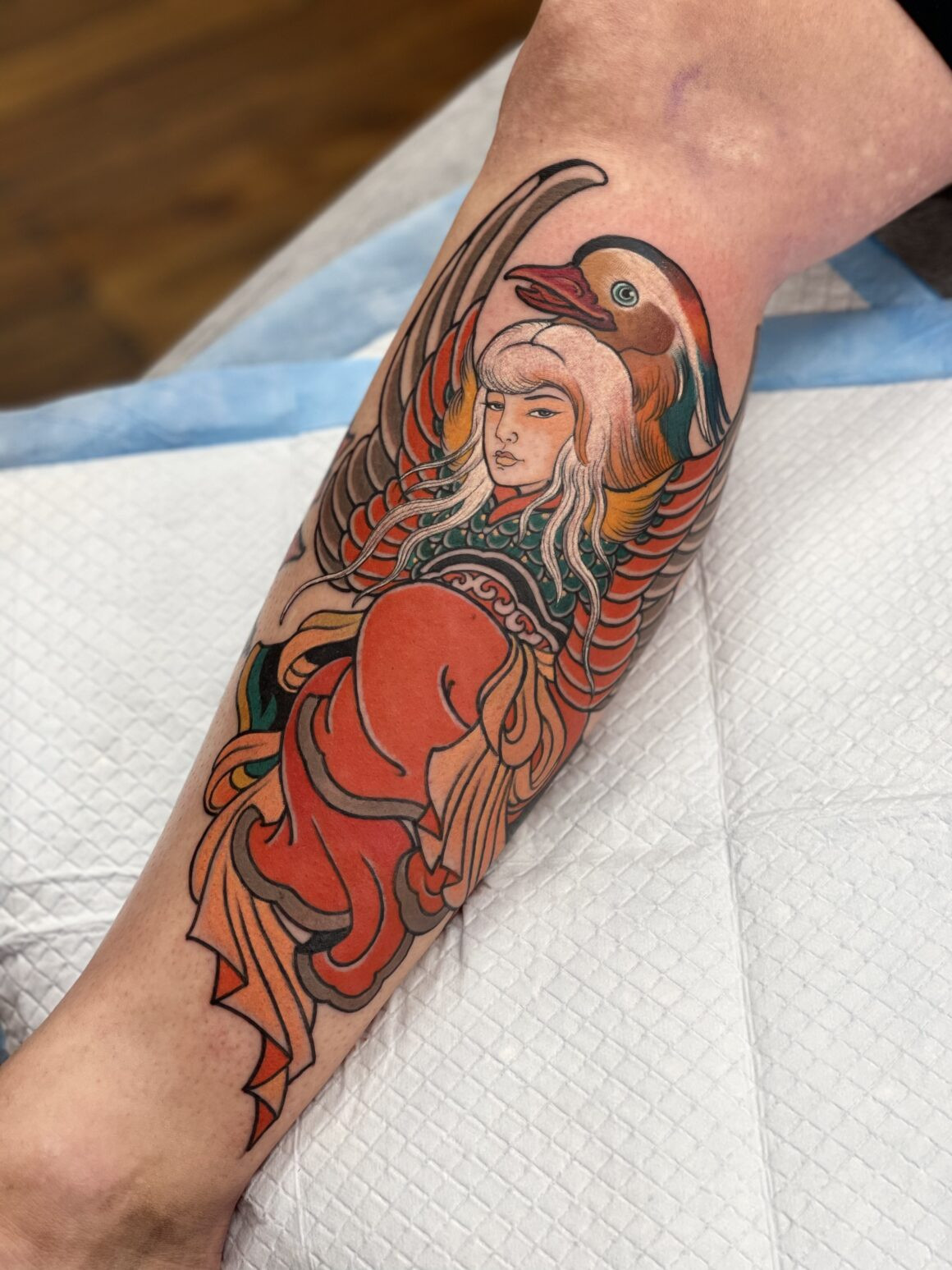 A detailed example of Miss Orange's oriental tattoo style, showcasing delicate lines and cultural motifs.