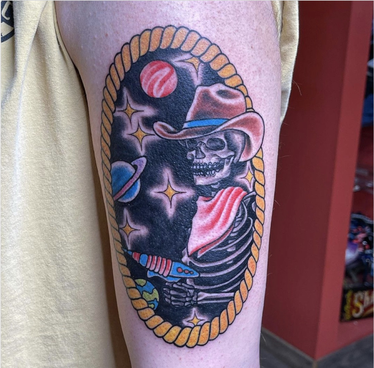 Colorful space cowboy tattoo with planets and stars