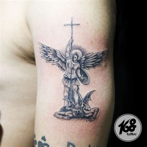 Examples of different St. Michael Archangel tattoo designs.