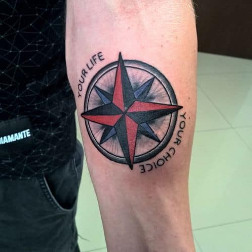 Nautical star tattoo on the elbow, a classic men tattoo idea with seafaring roots.