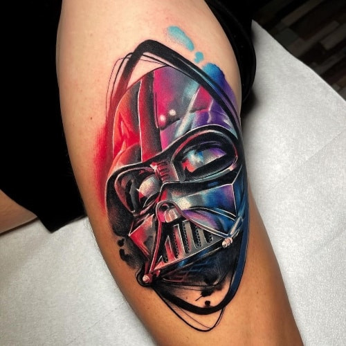 A colorful Yoda tattoo on a man's arm, whimsical and fun Star Wars tribute