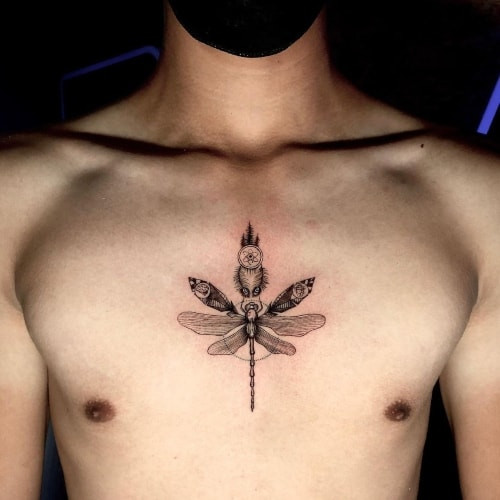 A sternum tattoo with geometric shapes on a man's center chest, symmetrical design