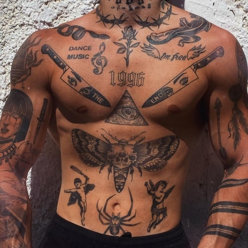 A stomach tattoo with a large scale design covering the abdomen of a man