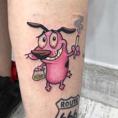 Cartoonish stoner character tattoo on a man's arm