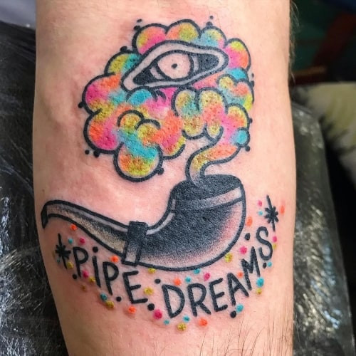 Food and pot leaf stoner tattoo on a man's leg