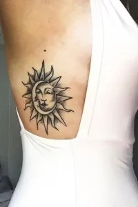 Harmonious sun and moon tattoo on the rib cage representing balance