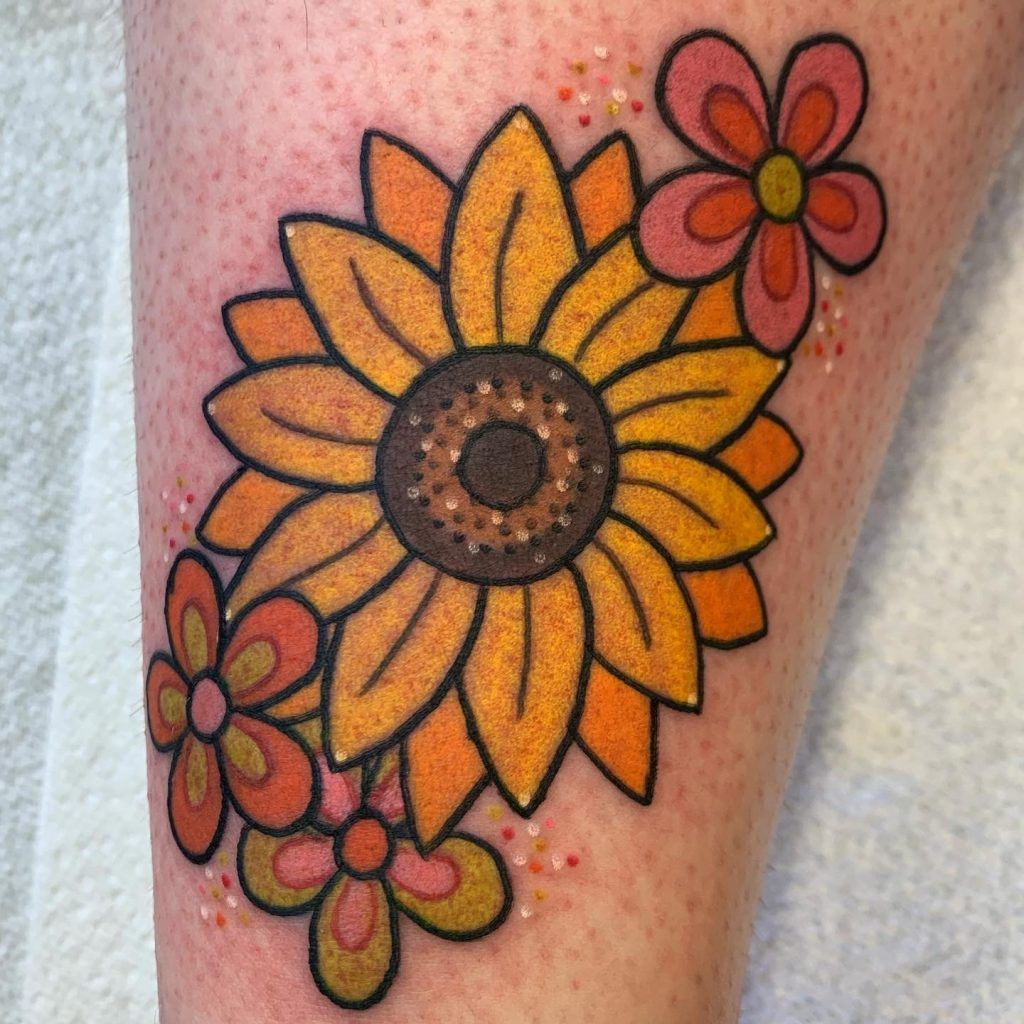 A cute sunflower tattoo with a smiling face in the center, radiating joy and happiness.