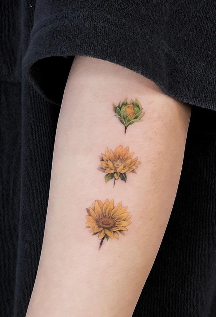 Blossoming sunflower arm tattoo