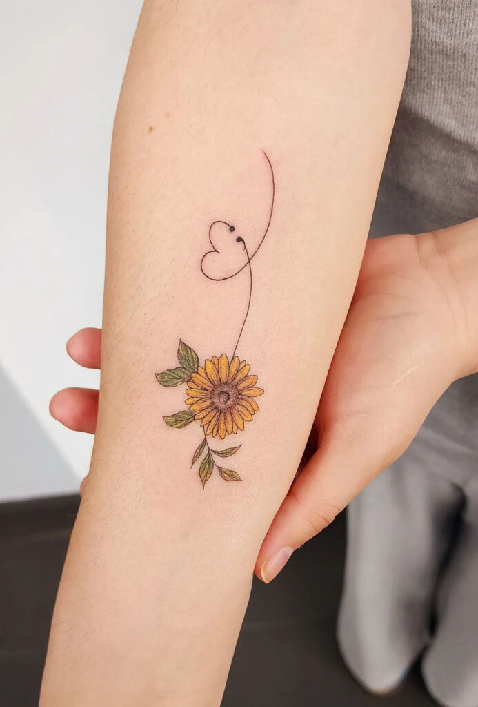 Sunflower, heart, and semicolon arm tattoo